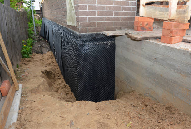SJ Waterproofing Pros technician performing targeted Sump Pump Installation assessment in Roanoke, IL